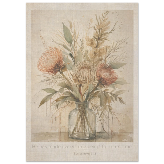 A botanical vintage art print featuring soft neutral flowers in a glass vase, displayed on a cream wall with the words 'He has made everything beautiful in its time'.