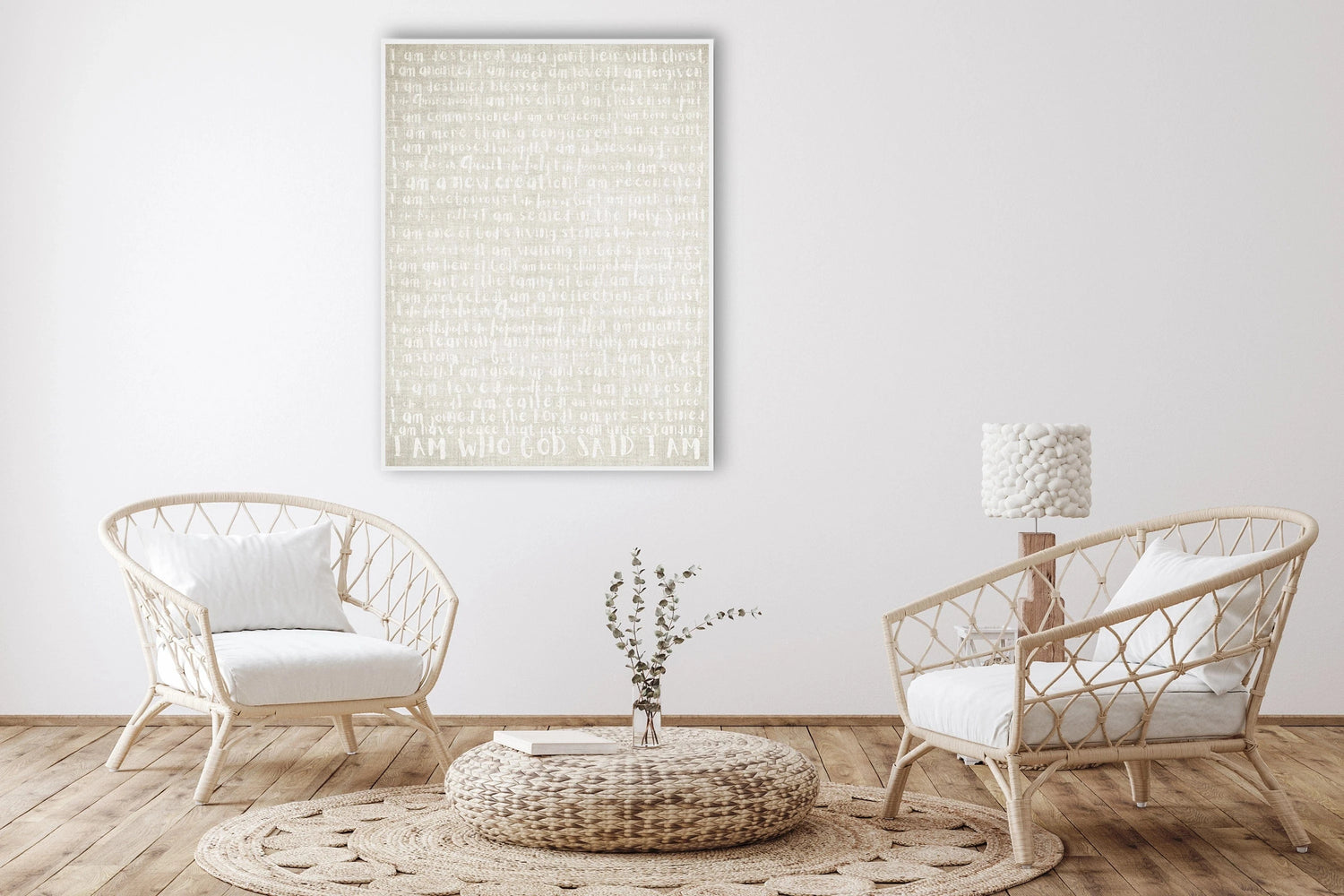 A christian art poster in a room set with 2 cane chairs poster is linen textire with writing that as positive christian affiramtions.