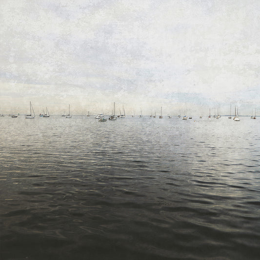 Peaceful print in muted tones  of the ocean with yachts in the far distance