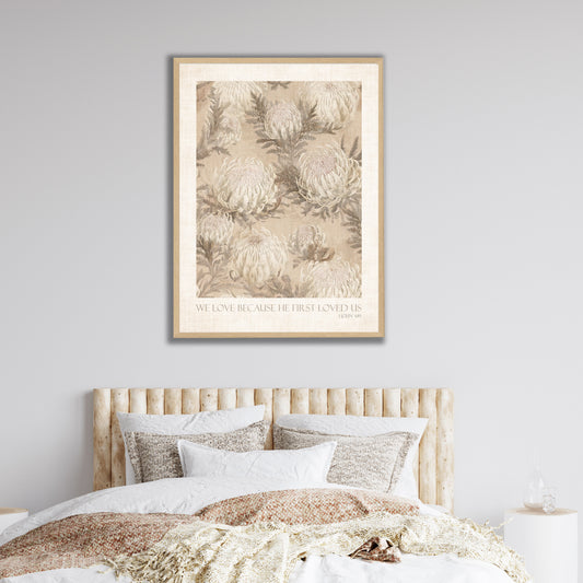 Vintage botanical floral art print in soft natural tones with the quote 'WE LOVE BECAUSE HE FIRST LOVED US' 