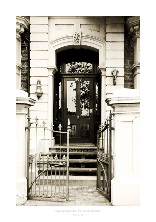 Monochrome symbolic print of an old gate and door that leads into an historical building 