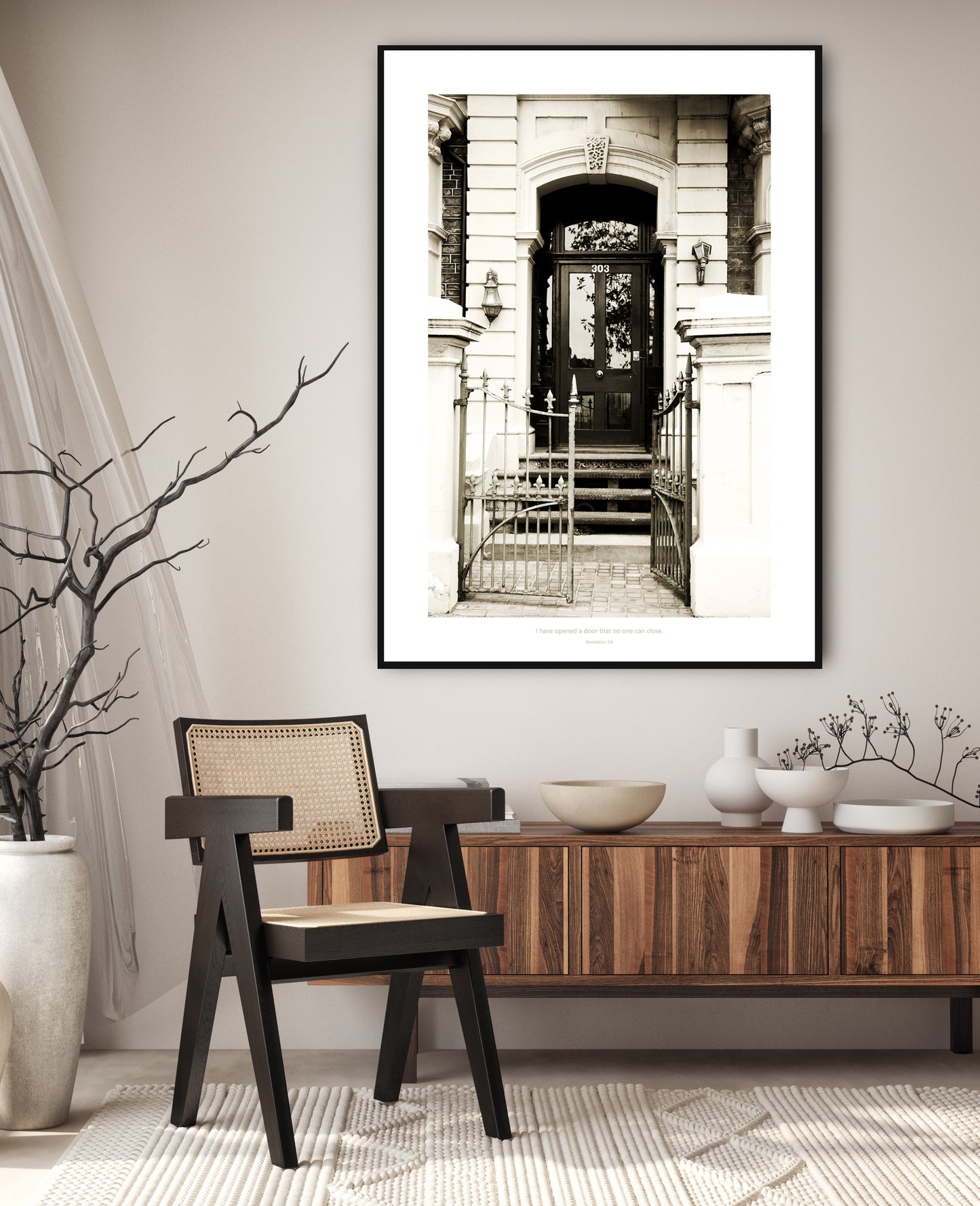 Monochrome print of an old gate and door that leads into an historical building 